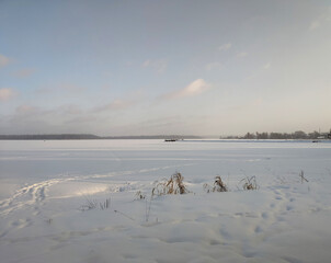 Blue winter landscape on frozen lake