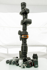 Precariously balanced digital camera tower and base with flashes