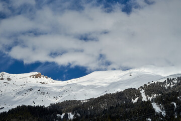 Image of a snow-capped mountain top.