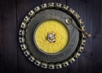 mango-flavored Phirni served in  traditional  plates