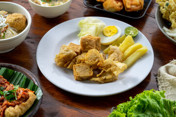 Indonesian specialities made from tofu are served on the table.