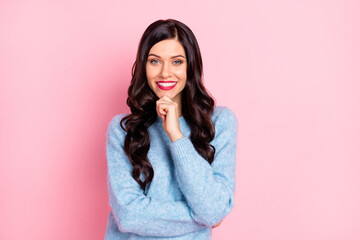 Photo of young girl finger chin look camera shiny smile wear blue pullover isolated pink color background