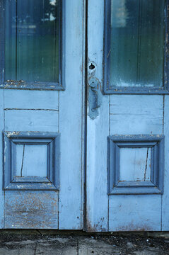 Old blue doors and windows of vintage arcade building
