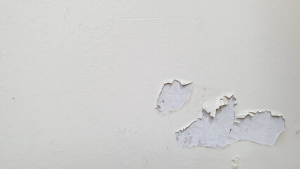 Closeup of peeling painted wall with copy spcae