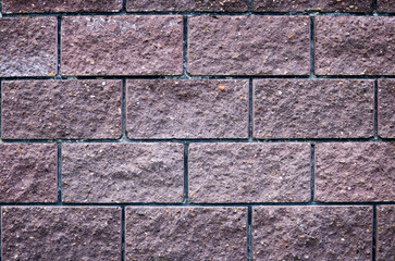 Dark brick wall - texture of stone close-up. Brick background.