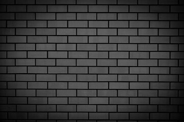 Black brick wall. Abstract background for design. Backdrop for product display.