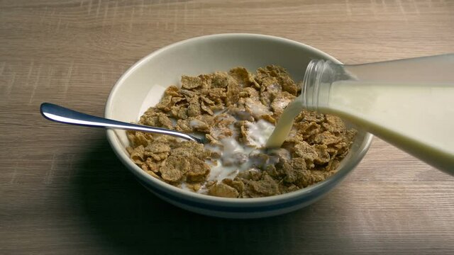Breakfast Cereal With Milk Pouring On