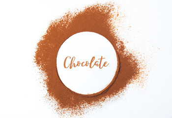 Circle made with powdered chocolate, with the word written in the center. International chocolate day
