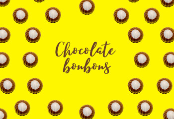 Circle made of chocolate bonbons, with the word written in the center. International chocolate day