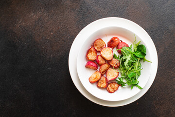 fried radish fresh vegetables original recipe keto or paleo diet veggie vegan or vegetarian food on the table healthy food meal snack copy space food background rustic. top view
