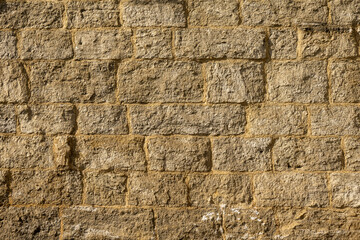 Golden stone wall in the sun to use as a background