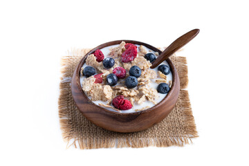 Rice and wholewheat cereal flakes with dried and fresh berries isolated on white