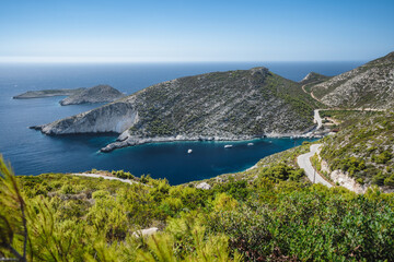Fototapeta premium Porto Vromi. Ionian sea bay with moored and anchored boats. Zakynthos island sightseeing spot. Greece