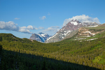 Morning view of Lone Walker and Rising Wolf mountains in Glacier National Park