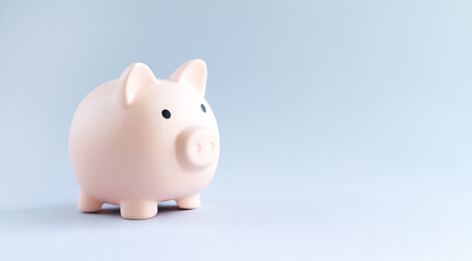 Pink piggy bank saving money concept
