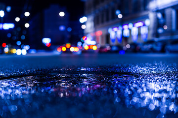 Nights lights of the big city, the city street with sparkling storefronts. Close up view of a...