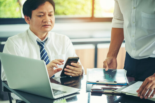 Businesses are offering alternative information to help decision makers in marketing planning. Diverse business team discuss statistical report infographics, charts share