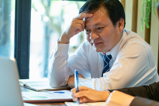 Businesses are offering alternative information to help decision makers in marketing planning. Diverse business team discuss statistical report infographics, charts share