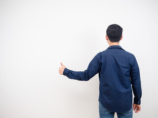 Back view of man jean suit show thumb up copy space white background