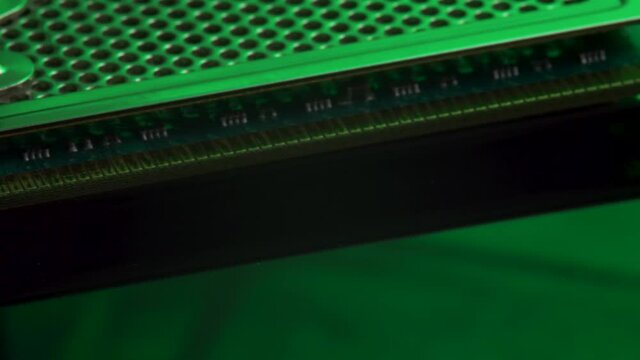 Computer memory RAM module on green light mirror background. Random access memory, computer PC detail or components. Computer hardware, electronic concept