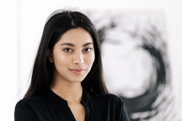 Portrait of attractive asian woman on light background