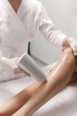 Laser hair removal, photoepilation, body and skin care concept. young woman remove hair at cosmetology clinic. close up shot, hygiene procedure concept