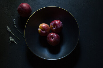 Preparation with vegetables on dark ground in the kitchen	