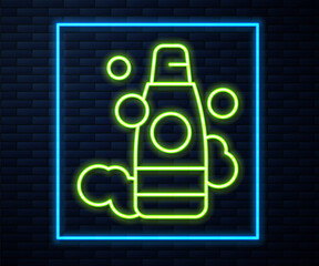 Glowing neon line Bottle of shampoo icon isolated on brick wall background. Vector