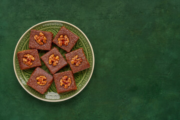 Middle eastern walnut semolina cake basbousa , namoora, hareesa . Traditional sweets celebration...