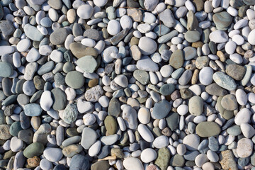 Background of seaside pebbles on coast of sea resort