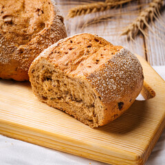 Closeup on loafs s of wheat bread on the wooden table