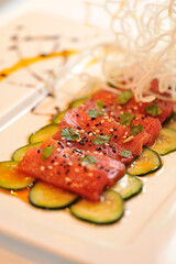raw tuna on a bed of squash