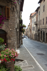 Fototapeta na wymiar Todi - Narrow medieval street, historic center in Umbria, Central Italy 