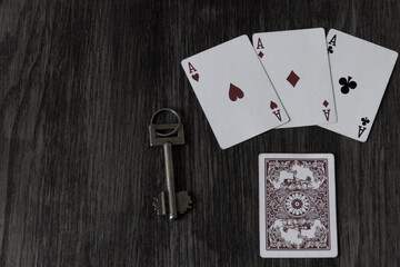 there are playing cards and keys on the table