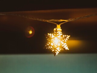 burning garland in the form of a snowflake close-up