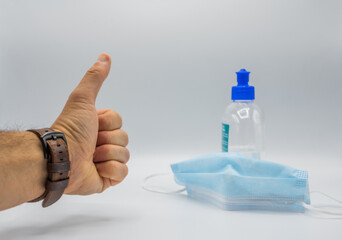 hands with a mark and hydrogel covid protection