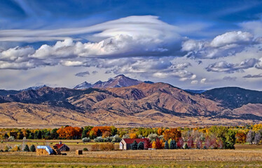 Lenticular clouds start to form in the Rocky Mountains above Long's Peak, Boulder County, Colorado