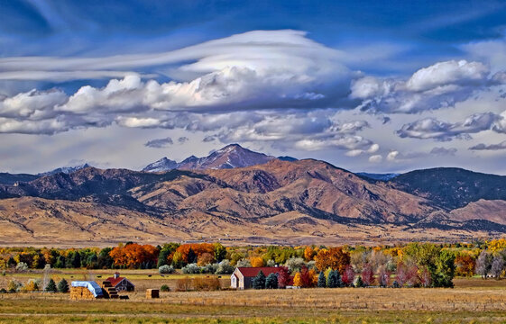 Lenticular clouds start to form in the Rocky Mountains above Long's Peak, Boulder County, Colorado