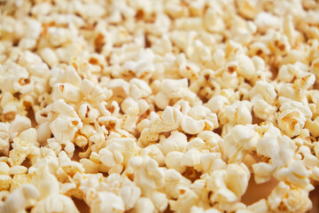 Yellow movie style popcorn background, texture. Lot of popcorn