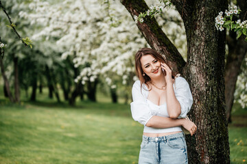A girl with a phone in her hand takes pictures of selfies, photos for Internet