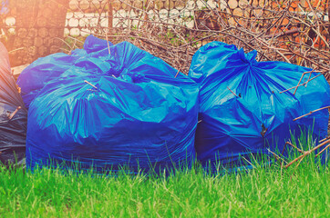 Blue plastic garbage bags, close-up.
