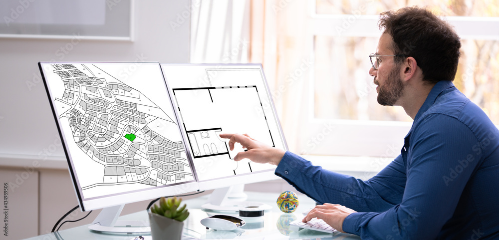 Poster Developer Looking At Land Plot Map