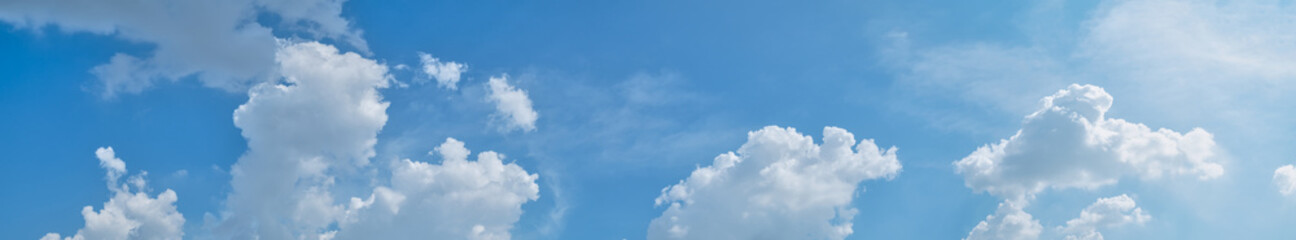 Naklejka na ściany i meble White clouds over blue sky panorama with copyspace