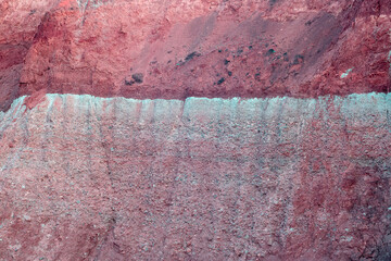 A layer of red clay and sand after excavation.