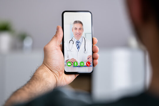 Man Having Video Chat With Doctor On Phone
