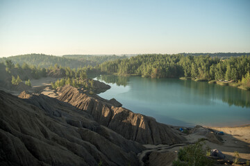 Russia, Tver region, konduki blue river, green forest, blue sky