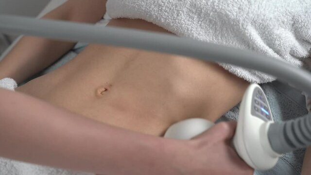 Close up of professional cosmetologist taking a nozzle for vacuum massage