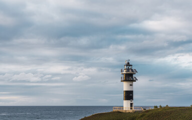 Fototapeta na wymiar Faro de Isla Pancha en Ribadeo, Galicia, Spain.