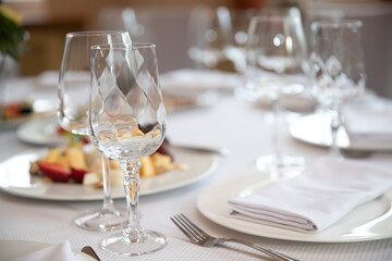 Decorated wedding table. Wedding table. Close-up of wine glass