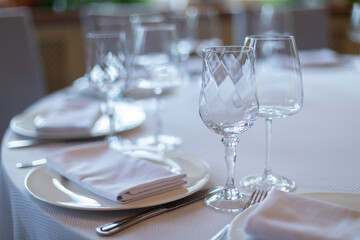 Decorated wedding table. Wedding table. Close-up of wine glass